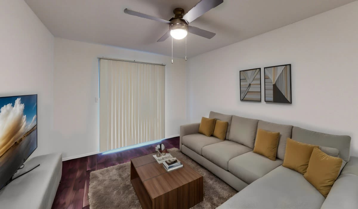 Living room with a ceiling fan at Patten East in Austin, Texas