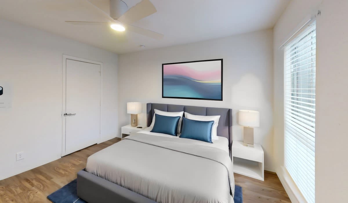 Bedroom with large windows at Patten East in Austin, Texas