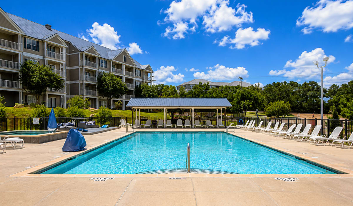Swimming pool  with lounge chair  at The April in Canyon Lake, Texas