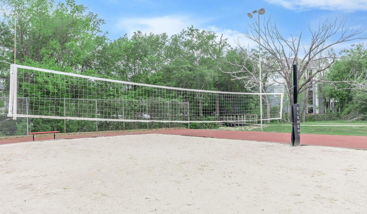 Sand volleyball court with upgraded net at The Element in Bryan, Texas