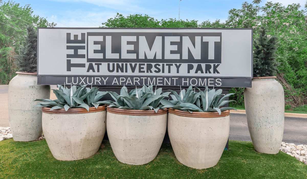 Upgraded large planters with green plants at The Element in Bryan, Texas