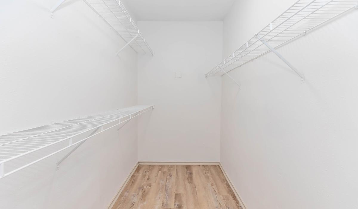 Upgraded wire shelving in a closet with wood floor at The Element in Bryan, Texas