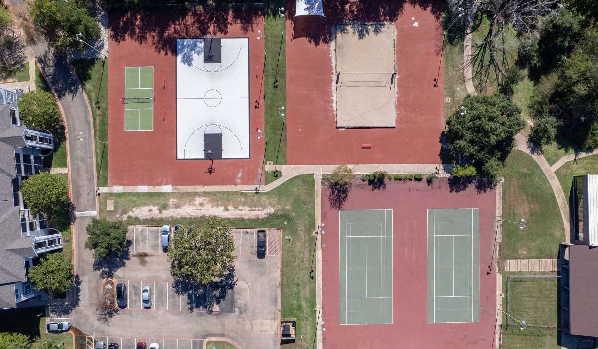Modern basketball court and tennis courts at The Element in Bryan, Texas