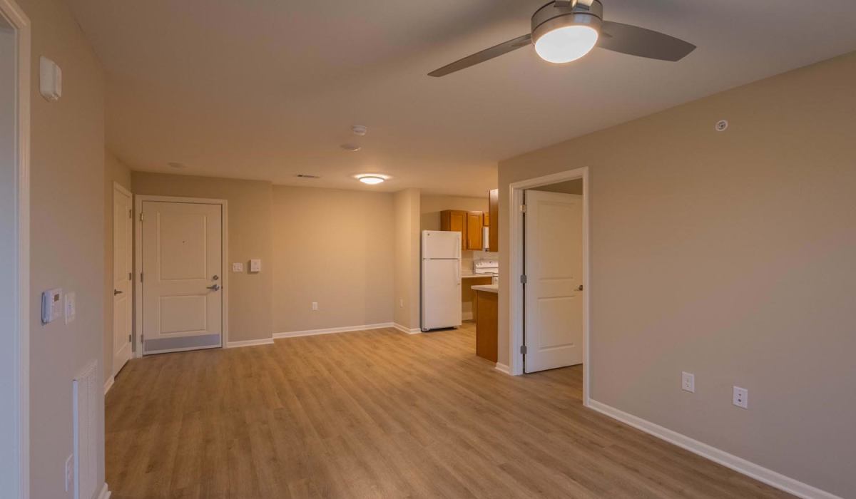Open layout with wood-style flooring at Juniper Crossing II in Columbus, Ohio
