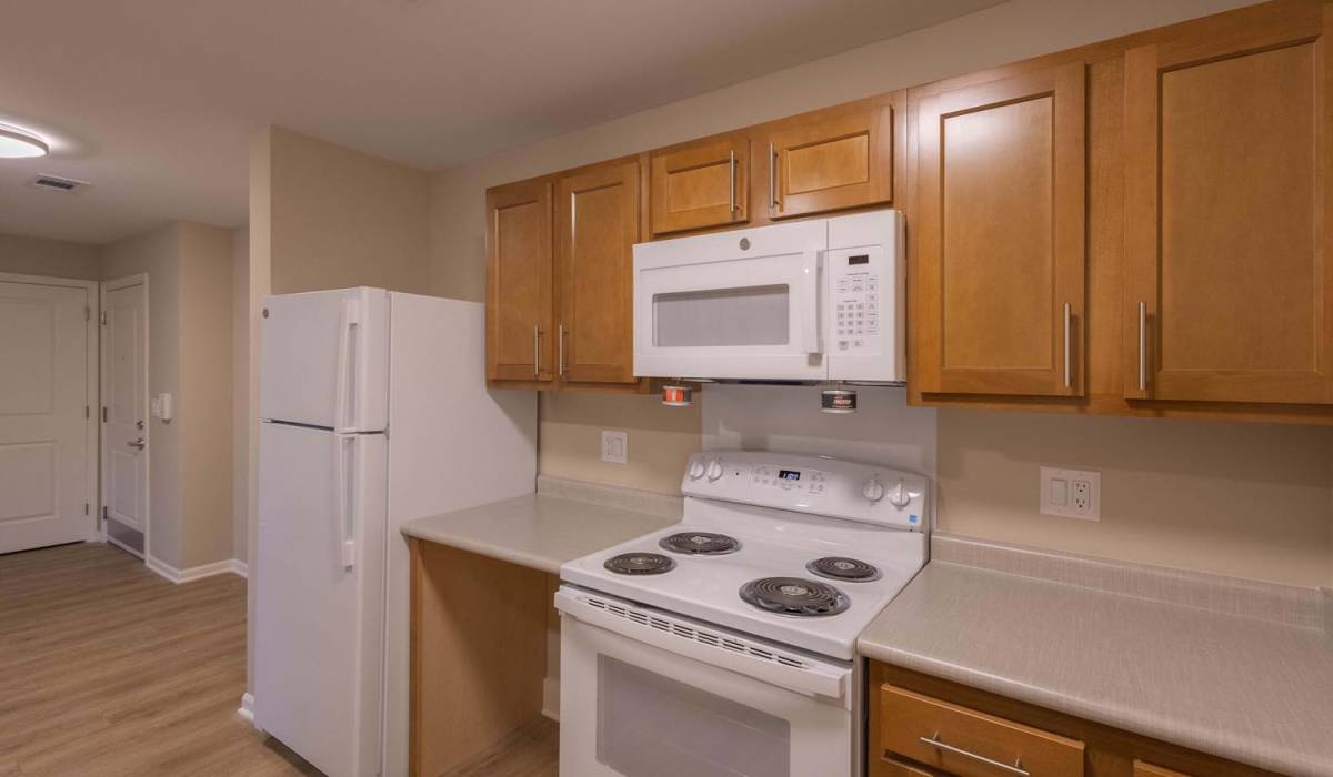 Modern kitchen with white appliances at Juniper Crossing II in Columbus, Ohio
