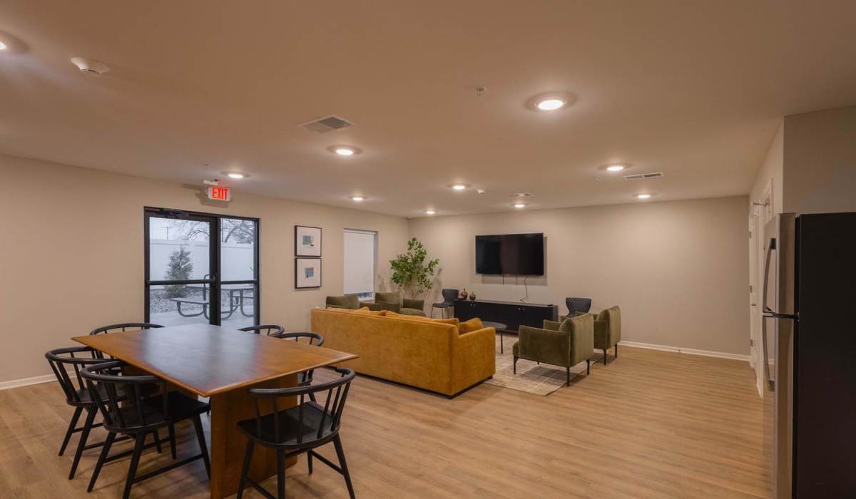 Wood-style flooring in modern lounge area at Juniper Crossing II in Columbus, Ohio