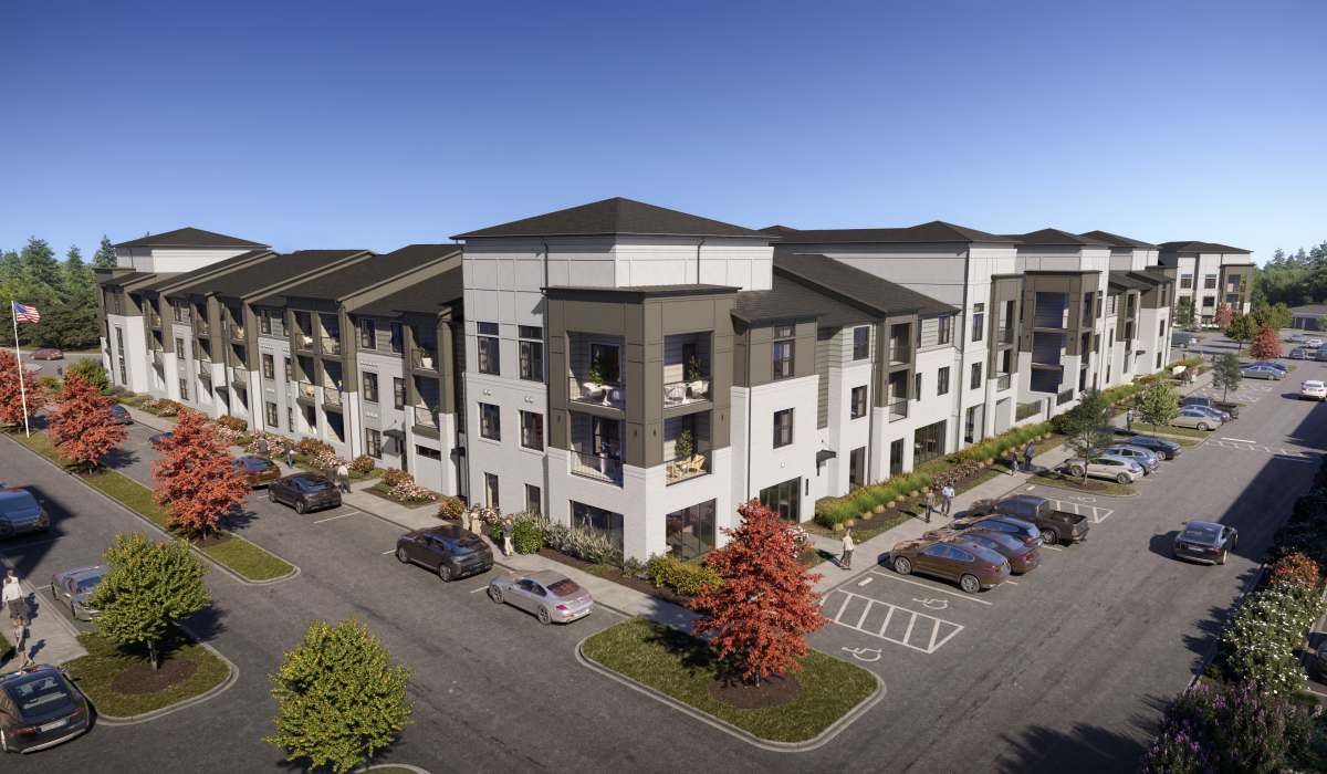 White and gray building with parking lot at The Heights at Materra in Baton Rouge, Louisiana