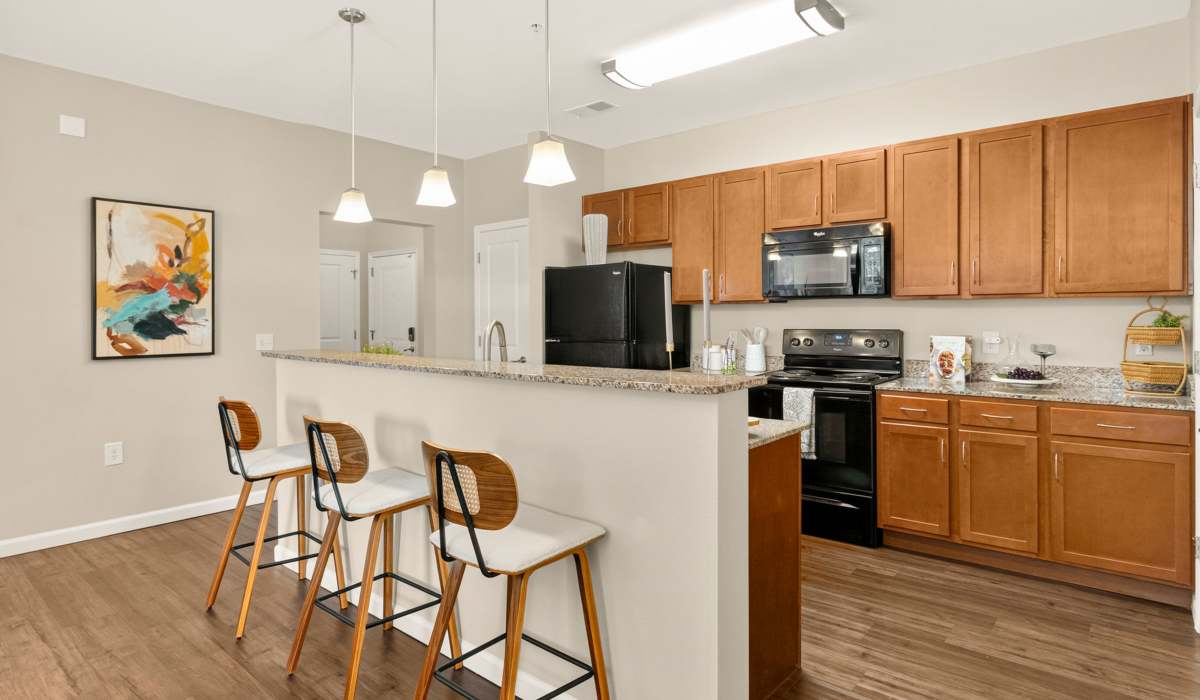 Kitchen with breakfast bar and seating at Cantare at Indian Lake Village in Hendersonville, Tennessee