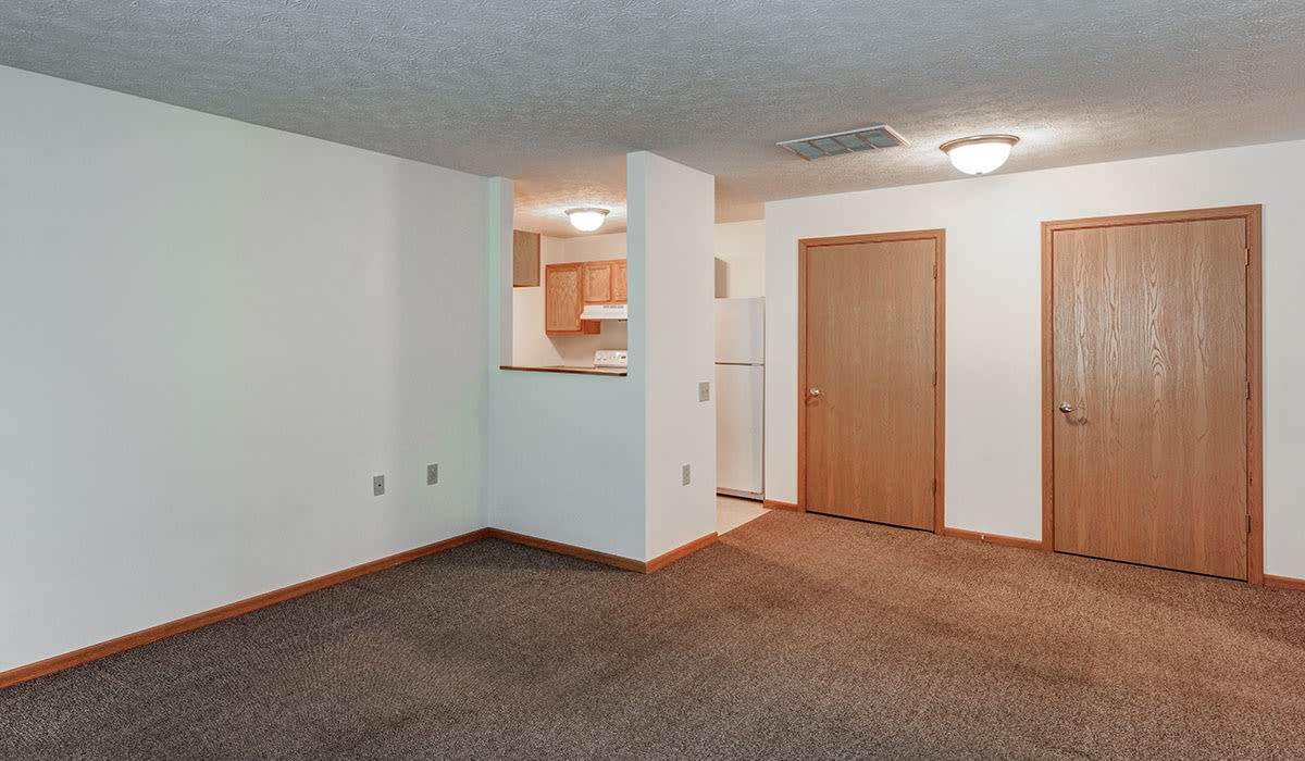 Carpeted floor with two wooden doors at Clover Ridge in McConnelsville, Ohio