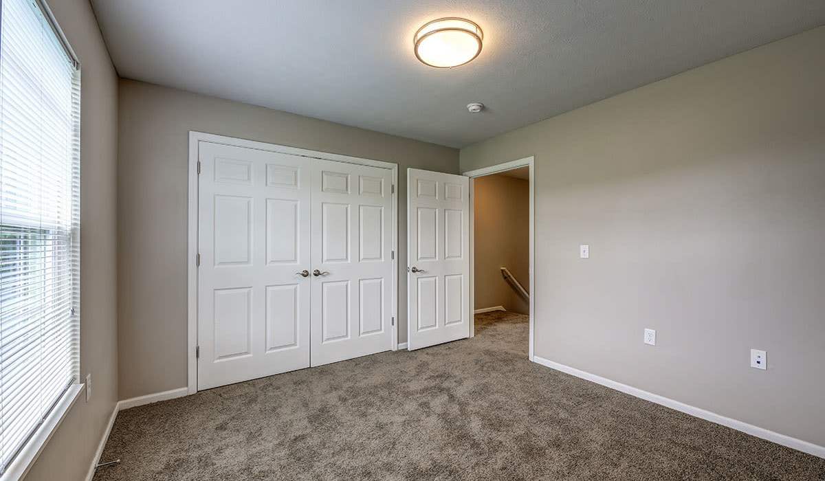 Bedroom with white doors at Majors Crossing in Rock Creek, Ohio 