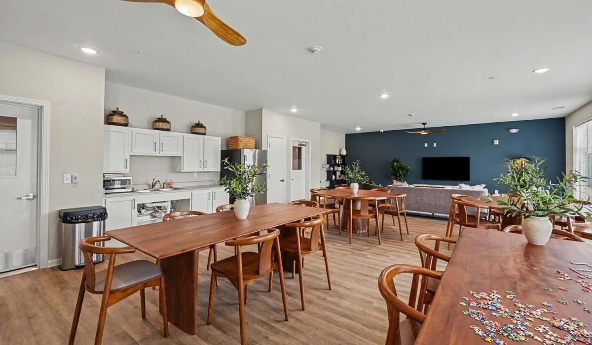 Bright unfurnished living room with connecting kitchen at Bridlewood Crossing in Louisville, Kentucky