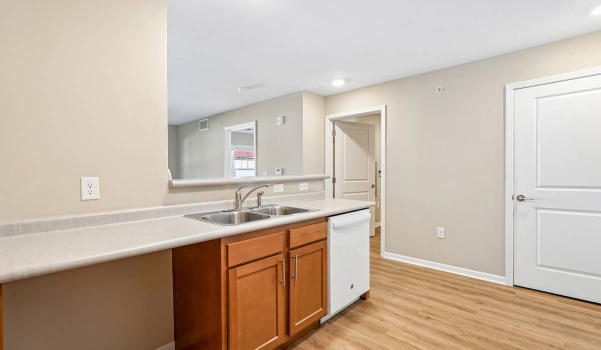 Kitchen with wooden cabinets at Juniper Crossing I in Columbus, Ohio 