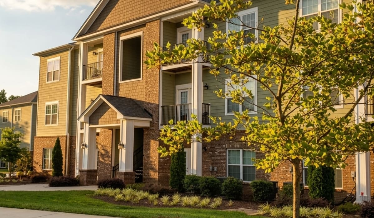 Property exterior with a lawn at Palisades at The Park in Greenville, South Carolina
