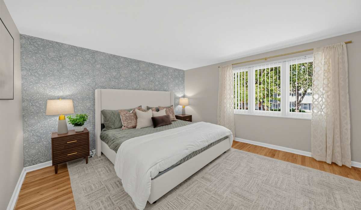 Spacious bedroom with large comfortable bed at Central Park in Park Forest, Illinois 