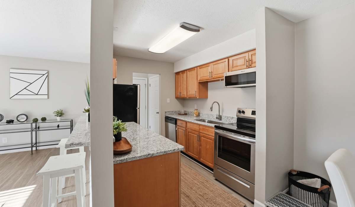 Large kitchen with appliances at Collins Crossing Apartments in Carrboro, North Carolina