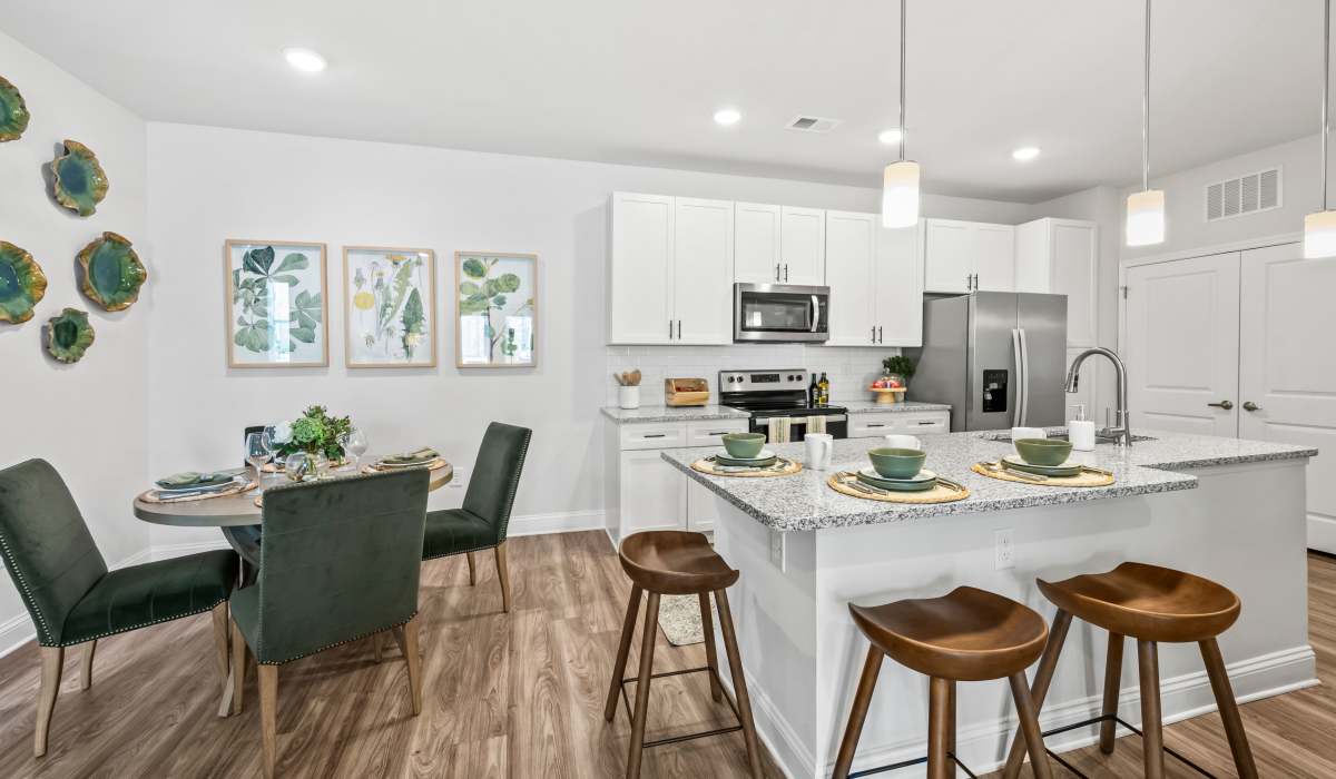 Beautiful kitchen with island in a model home at The Standard at Pinestone in Travelers Rest, South Carolina