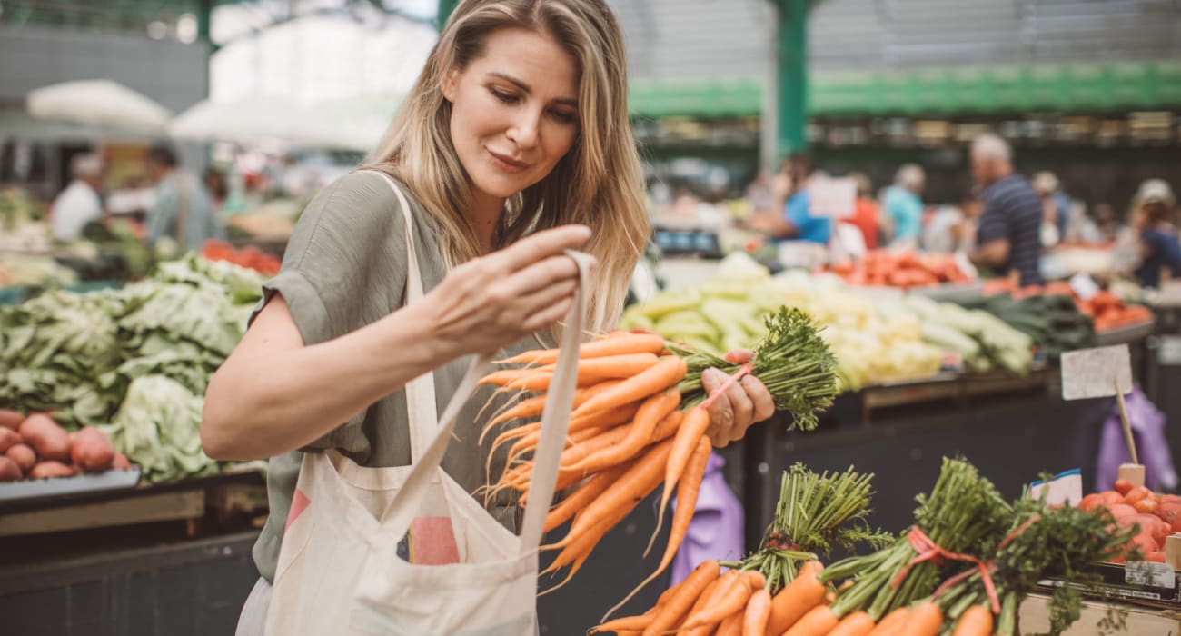 Resident shopping for produce in Bethlehem, Pennsylvania near Lehigh Plaza Apartments