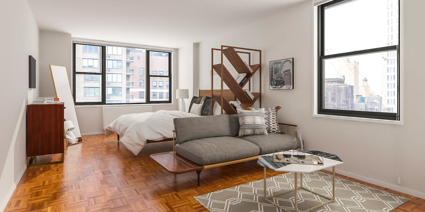 Open and well lit studio with nice wood style flooring at Carnegie Mews in New York, New York