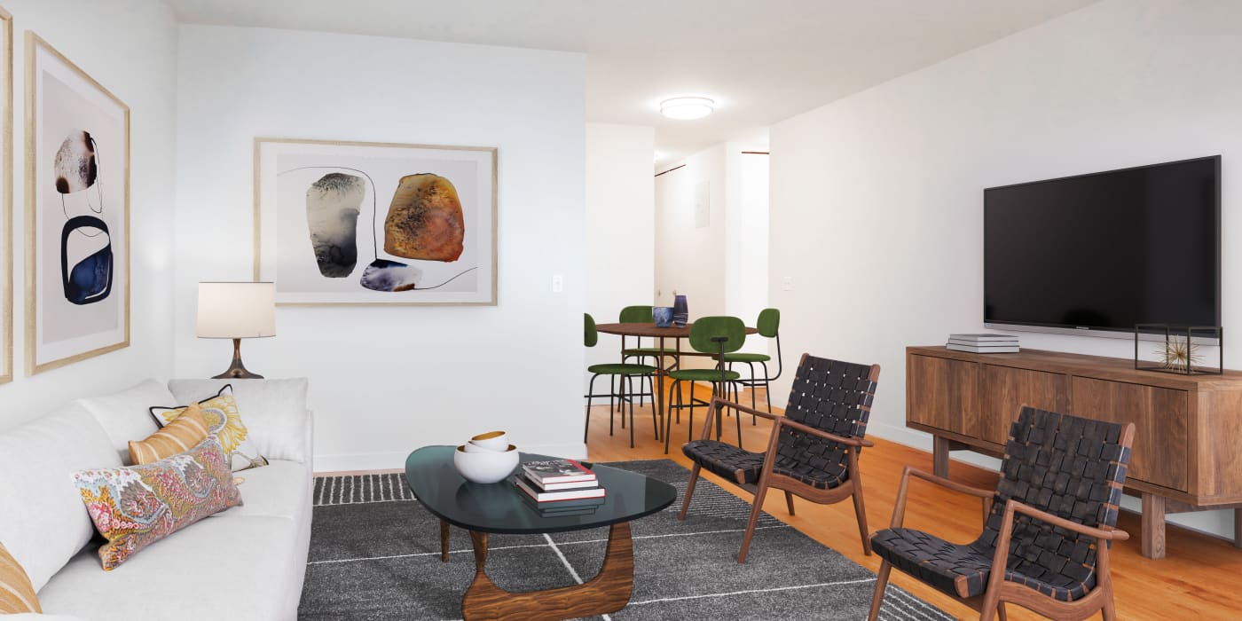 Spacious living room area with modern looking furniture at Carnegie Mews in New York, New York