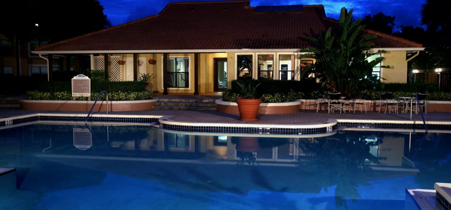 Swimming pool at night at Tuscany Pointe at Somerset Place Apartment Homes in Boca Raton, Florida