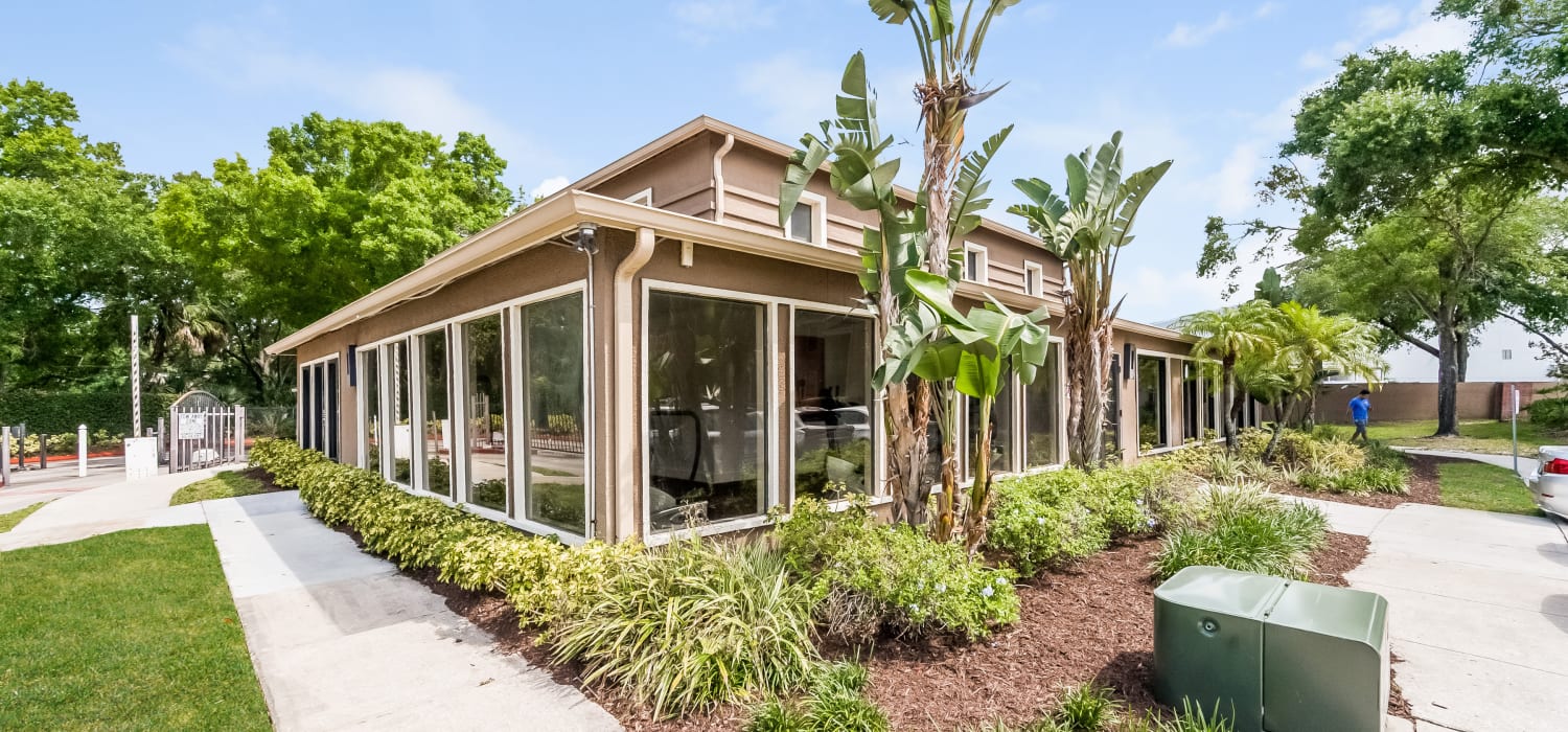 Well-landscaped exterior of the fitness center at Tuscany Pointe at Tampa Apartment Homes in Tampa, Florida