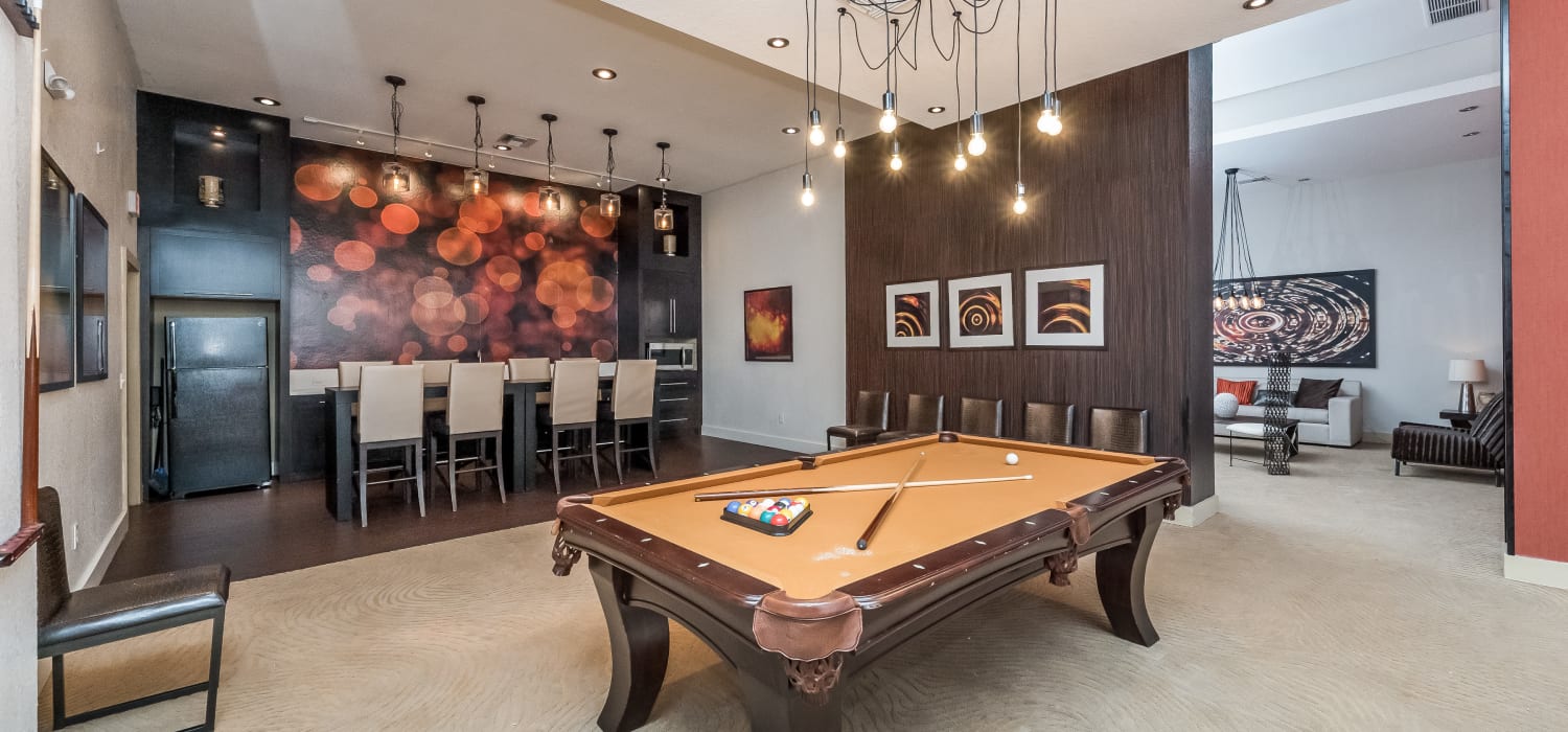 Resident lounge with a pool table at Tuscany Pointe at Tampa Apartment Homes in Tampa, Florida