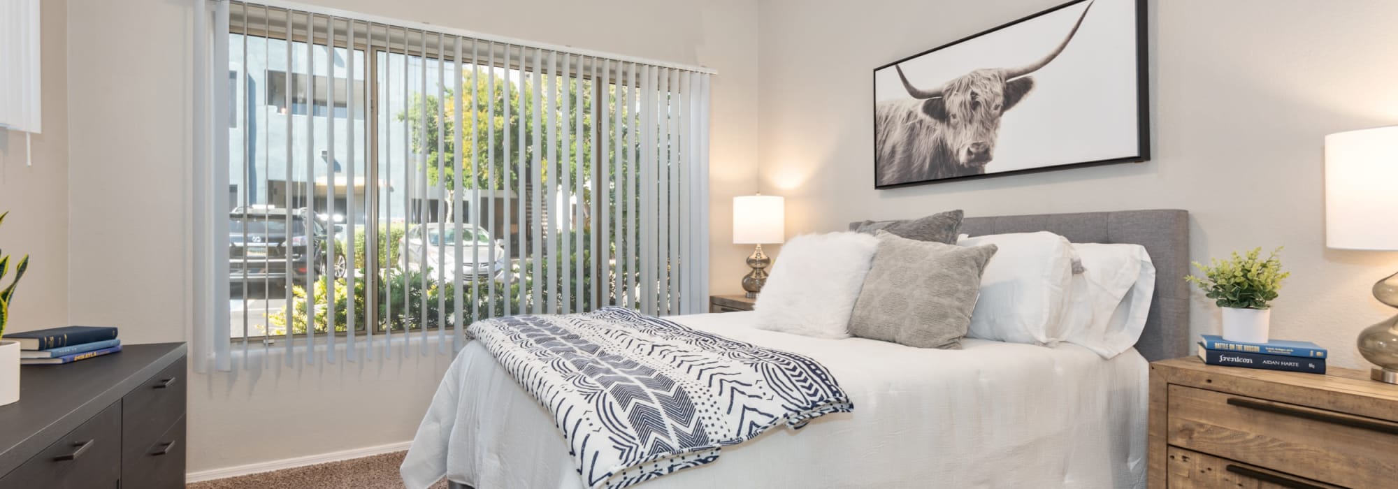 Comfy and well lit bedroom in a model home at Luna at Fountain Hills in Fountain Hills, Arizona