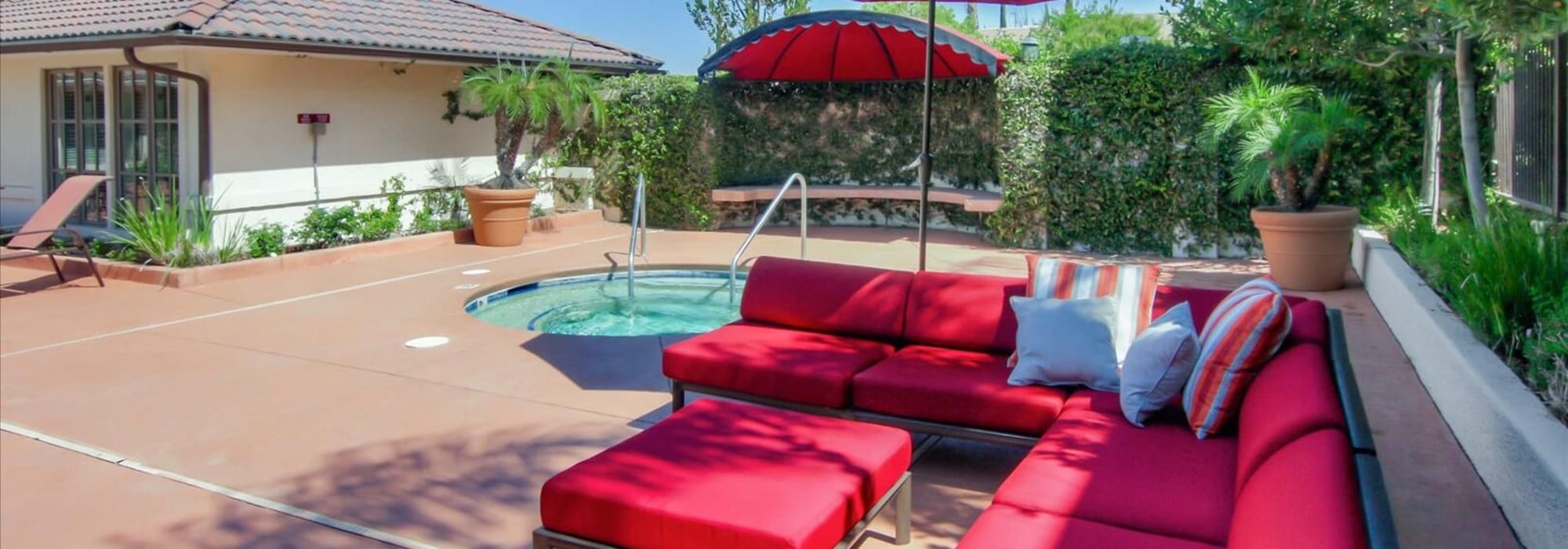 Patio seating by the hot tub at Park Sorrento in Bakersfield, California