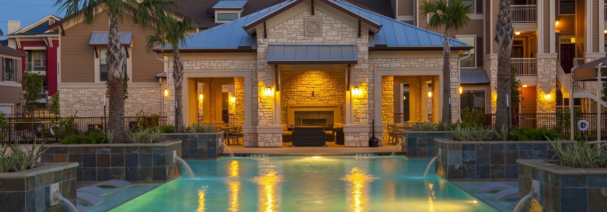 Hotel style pool at dusk at The Crossing at Katy Ranch in Katy, Texas