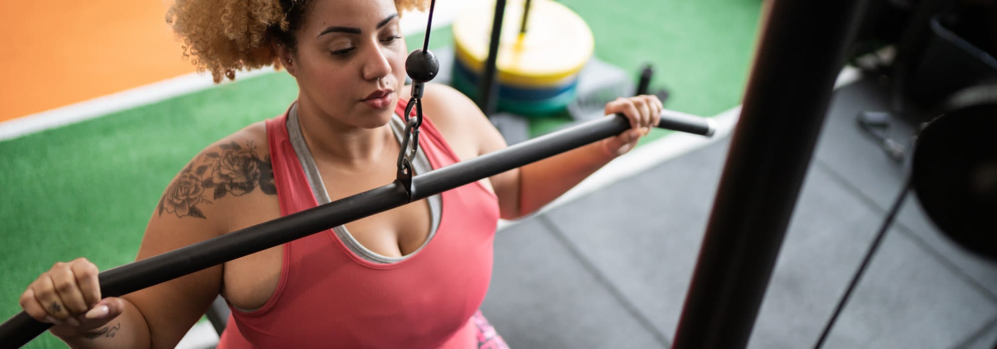 Woman working out in the fitness center at Lyford Apartments in Tiburon, California