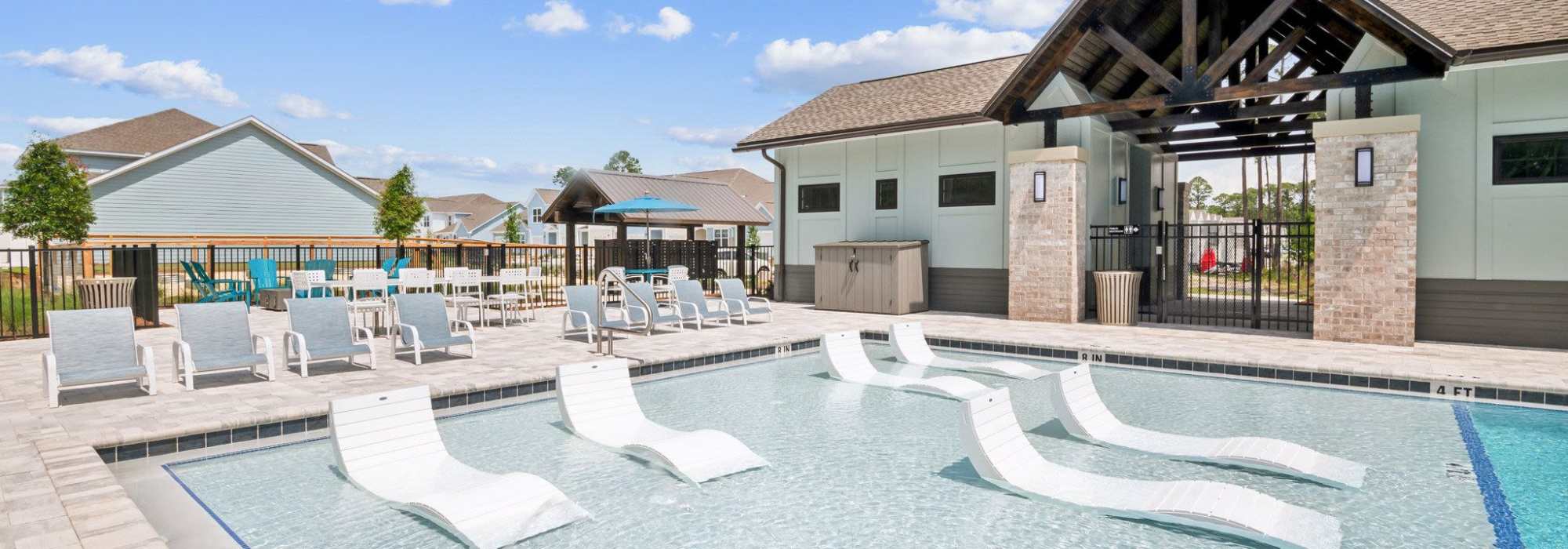 Lounge chairs in our swimming pool shallow section at Artisan Living North Beach in Santa Rosa Beach, Florida