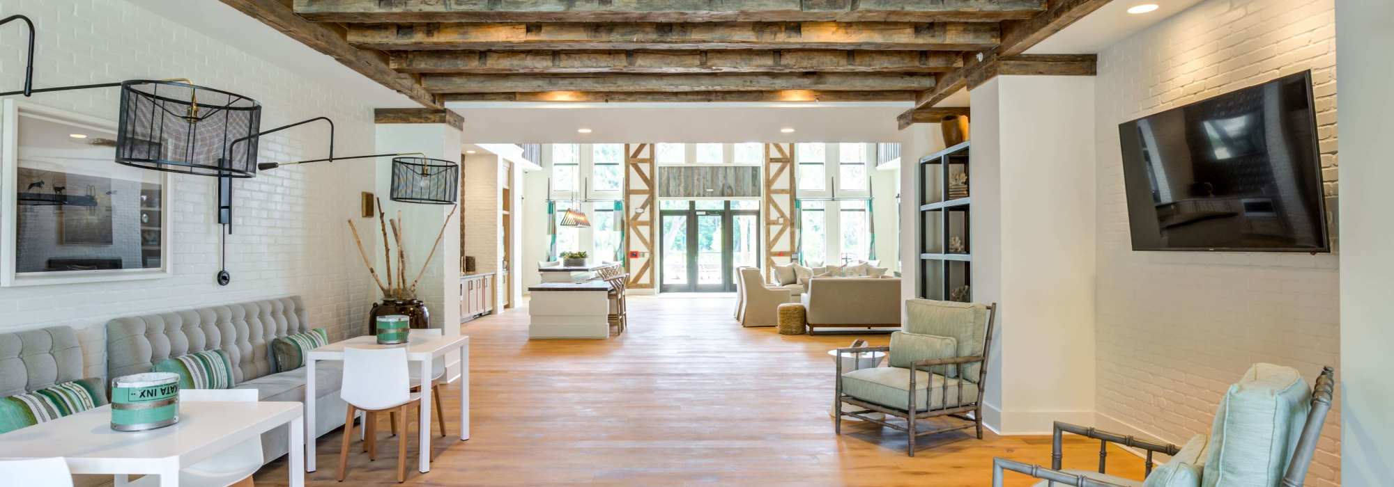 Televisions and furniture fill the wide hallways at The Heyward in Charleston, South Carolina 
