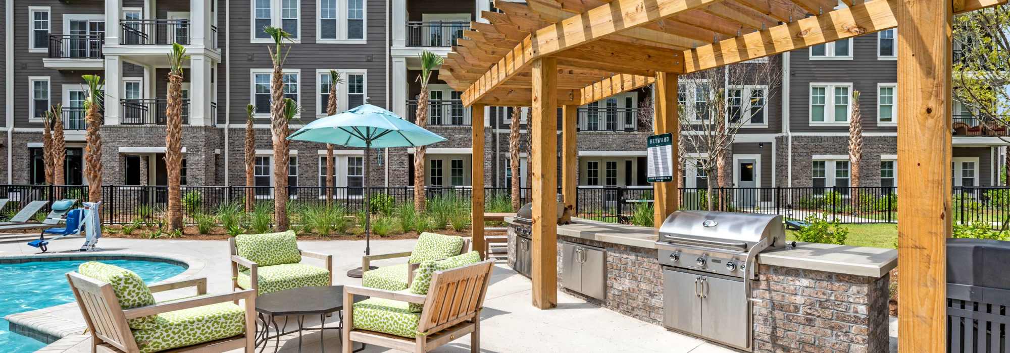 Comfortable patio furniture around the pool at The Heyward in Charleston, South Carolina