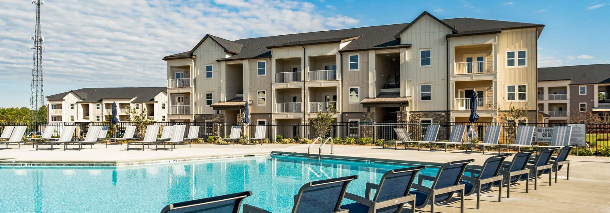 Swimming pool with poolside lounge chairs at The Standard at Pinestone in Travelers Rest, South Carolina