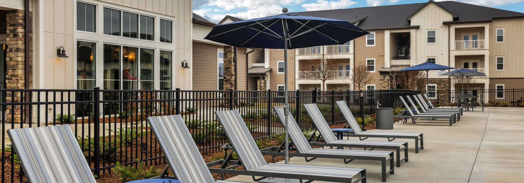 Lounge chairs next to our swimming pool at The Standard at Pinestone in Travelers Rest, South Carolina
