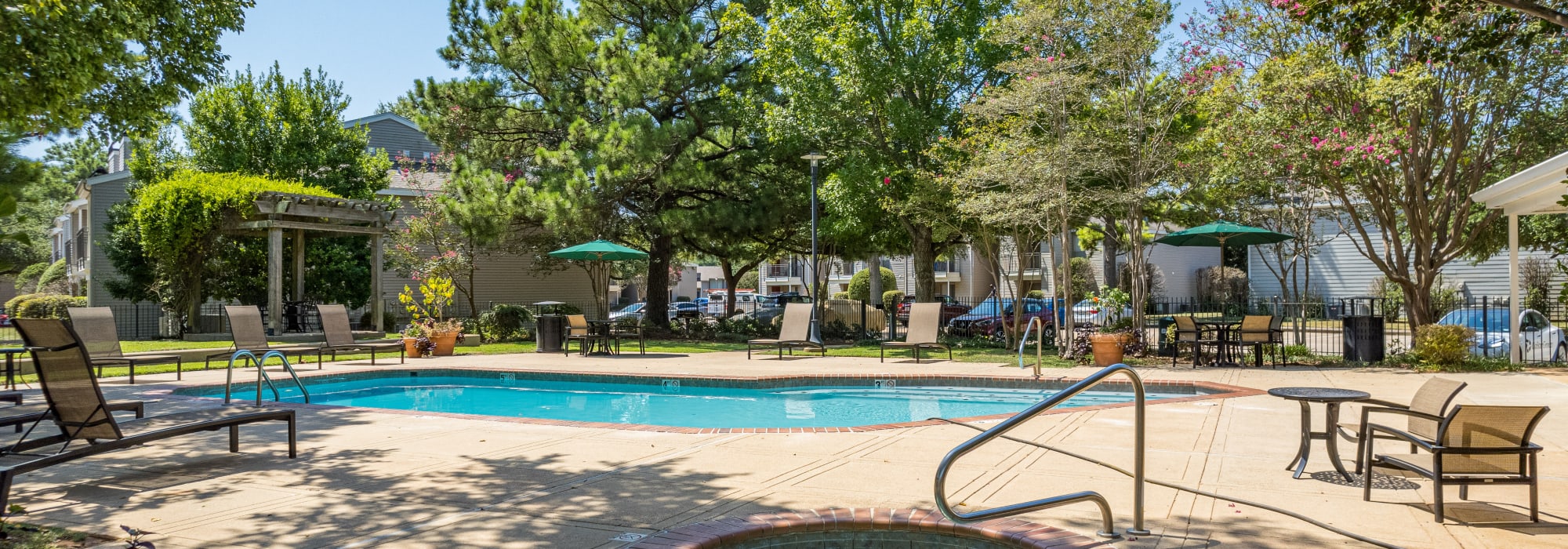Swimming pool with lounge chair at Millicent Crossing in Shreveport, Louisiana