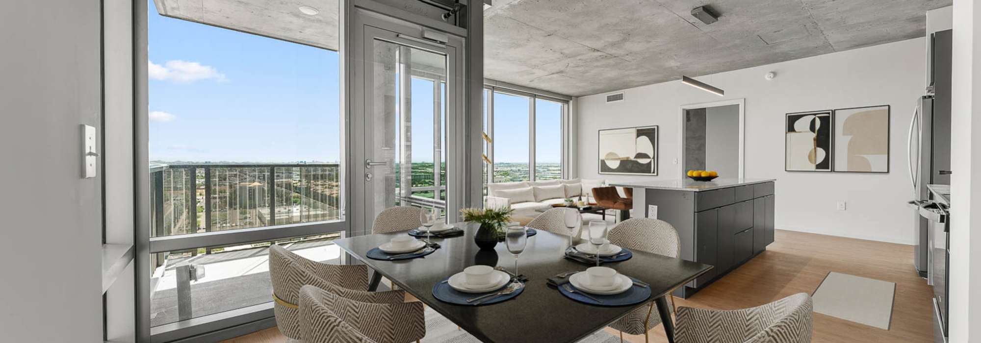 Living room, dining area, and kitchen at PALMtower in Phoenix, Arizona