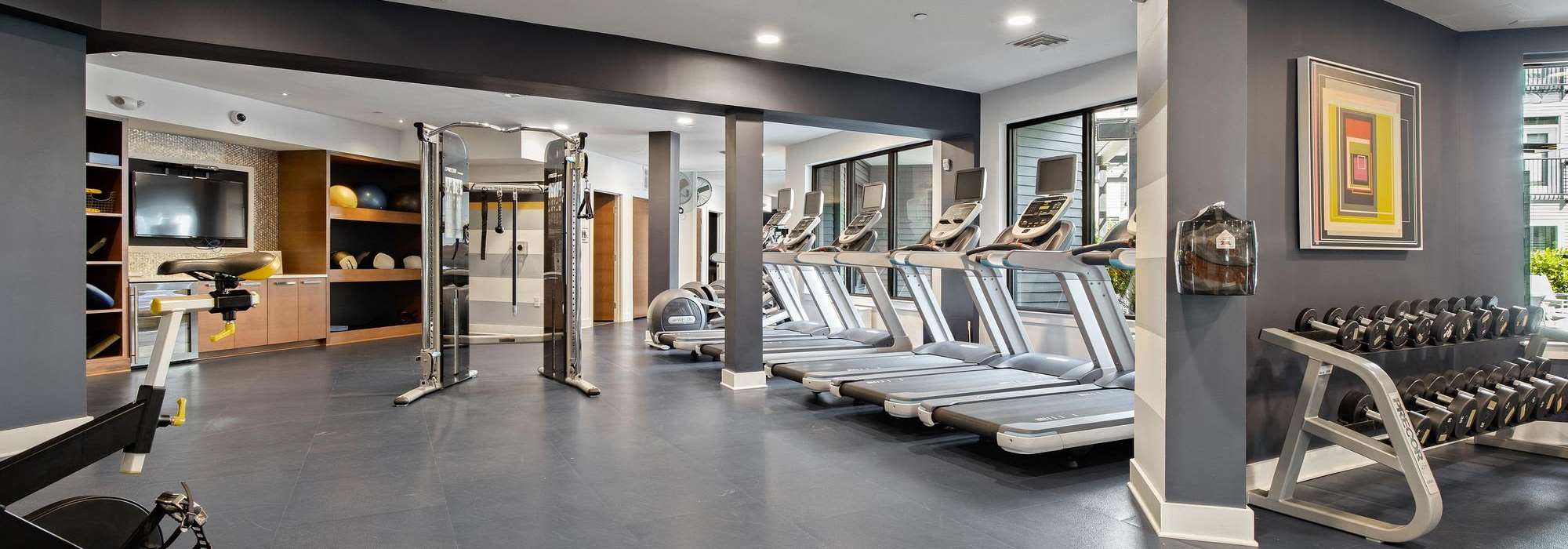Fitness center with cardio and weights at The Dartmouth North Hills in Raleigh, North Carolina