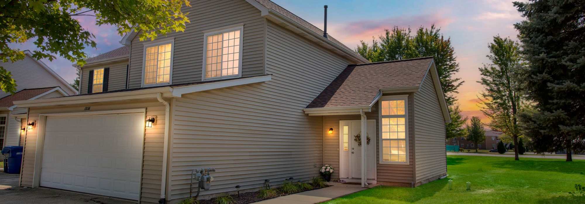 Home exterior at night at  Meadowlark Townhomes in Dekalb, Illinois