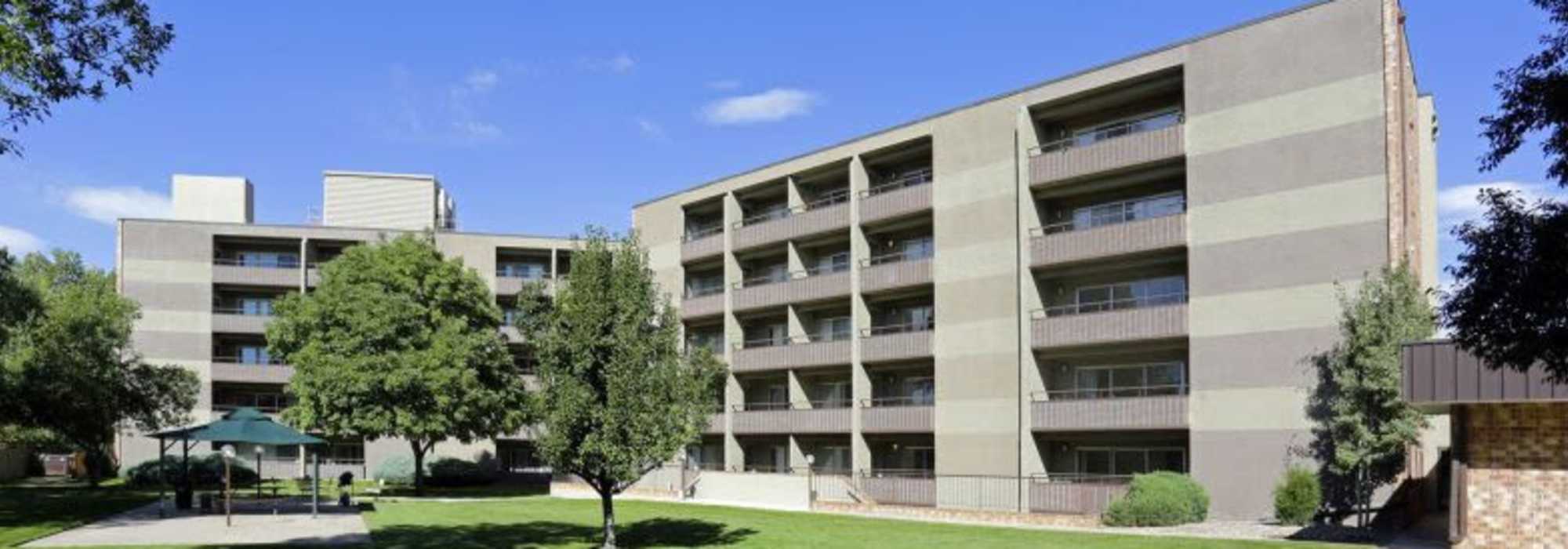 Exterior shot of the complex with plenty of plantation at The Windermere in Littleton,Colorado