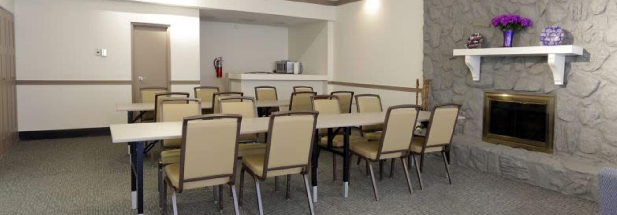 Spacious community room with large tables at The Windermere in Littleton,Colorado