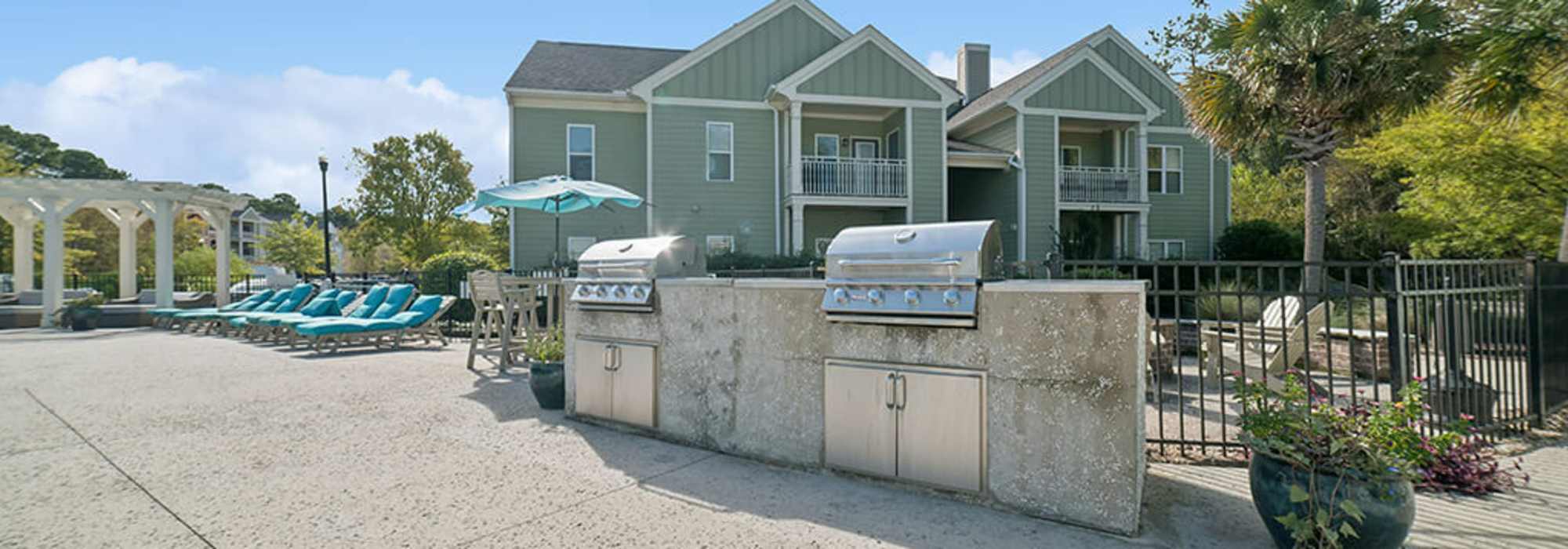 Outdoor grill stations at The Apartments at Shade Tree in Johns Island, South Carolina