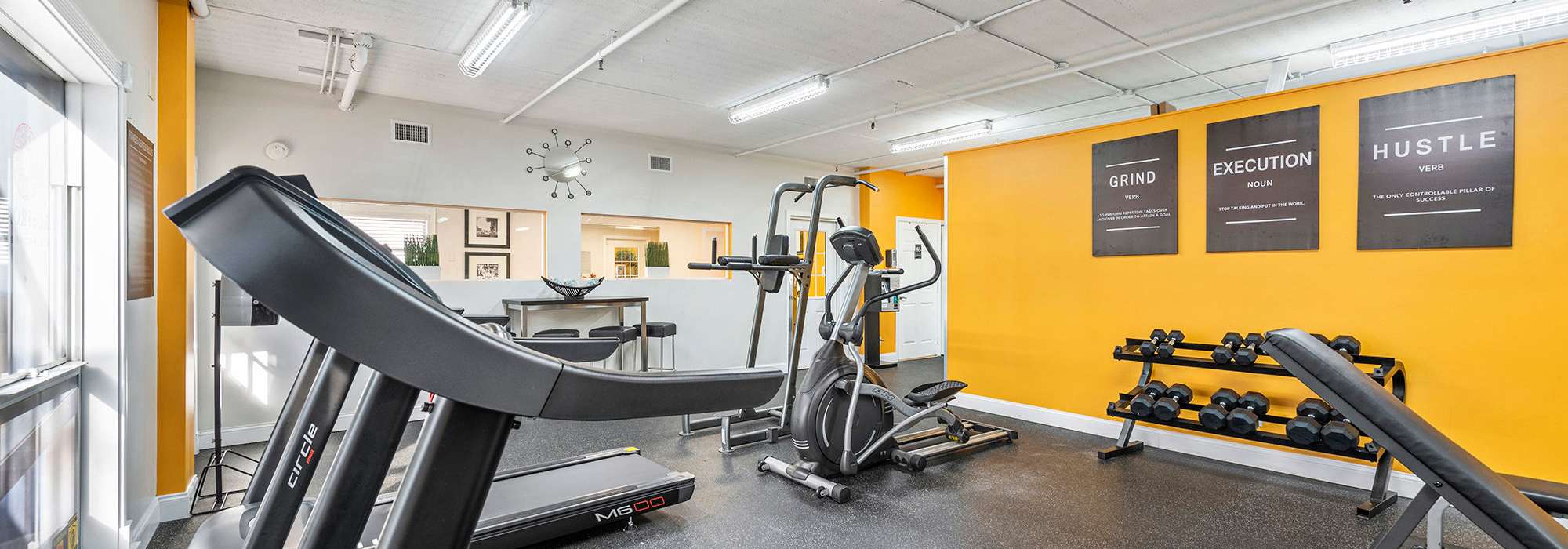 Fitness center with treadmill at The Crossroads At Downtown Boca in Boca Raton, Florida