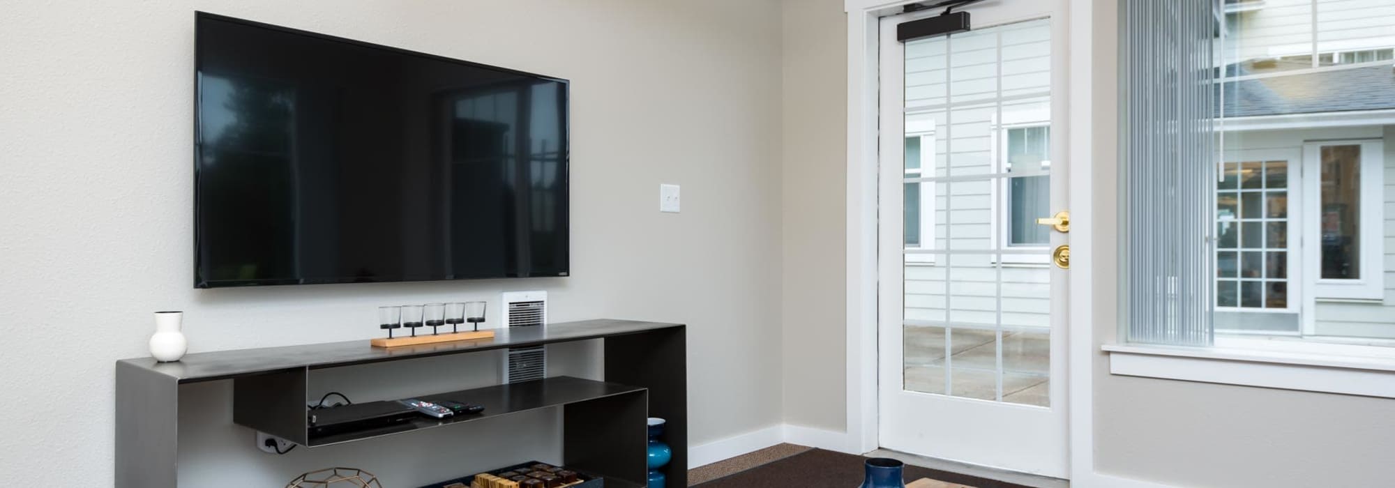 Clubhouse with large television at Chinook Way Apartments in Fairview, Oregon