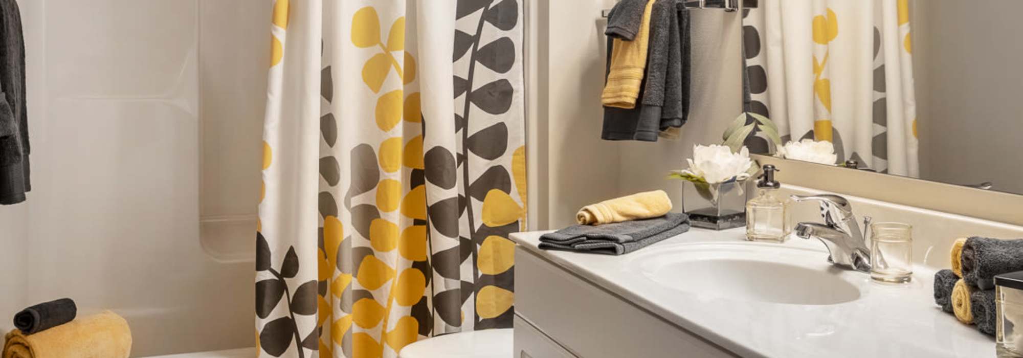 Apartment bathroom with a tub at Deer Creek in Middleton, Wisconsin
