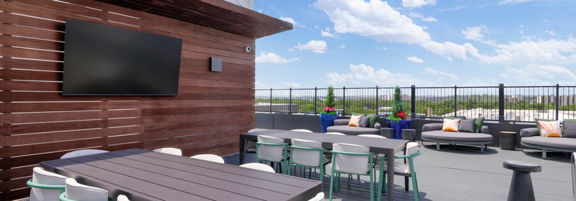 Rooftop lounge with seating and dining table at Corazon in Austin, Texas