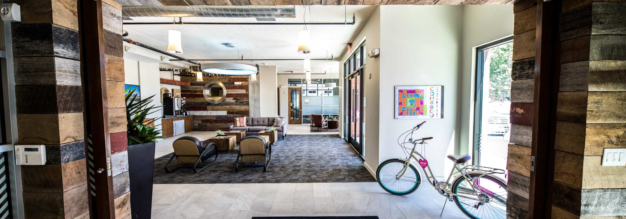 Modern lobby with wood accents and seating area at Corazon in Austin, Texas
