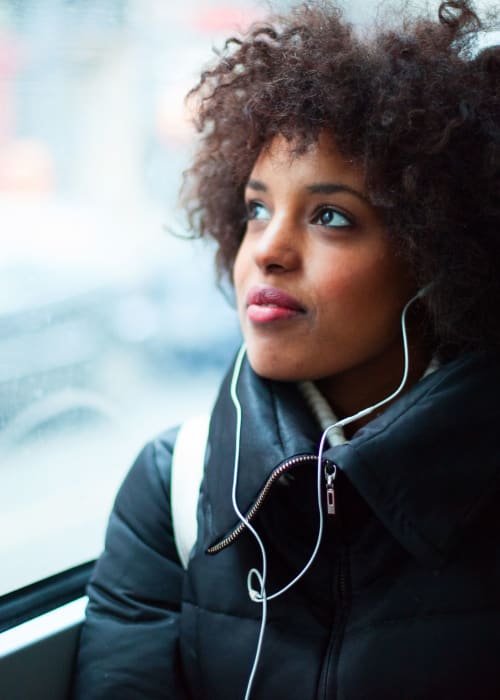 Student on her way to class with her headphone in near The View on Pavey Square in Columbus, Ohio