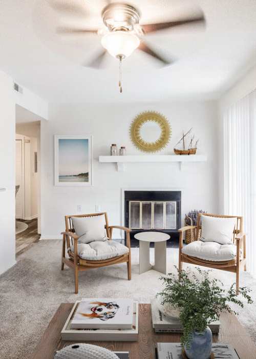 Stylish living room with fireplace at Sand Ridge in Wilmington, North Carolina