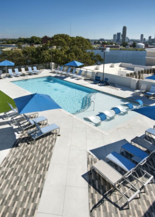 A resort-style swimming pool and lounge chairs at The Mill at Westside in Atlanta, Georgia